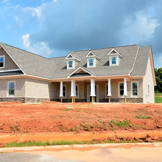 A house that is being built on the side of a hill.